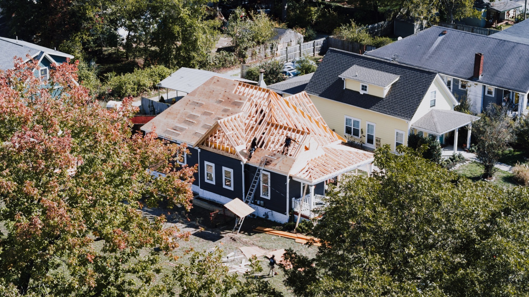 Aerial view of a home mid-roof-build in a north-metro neighborhood